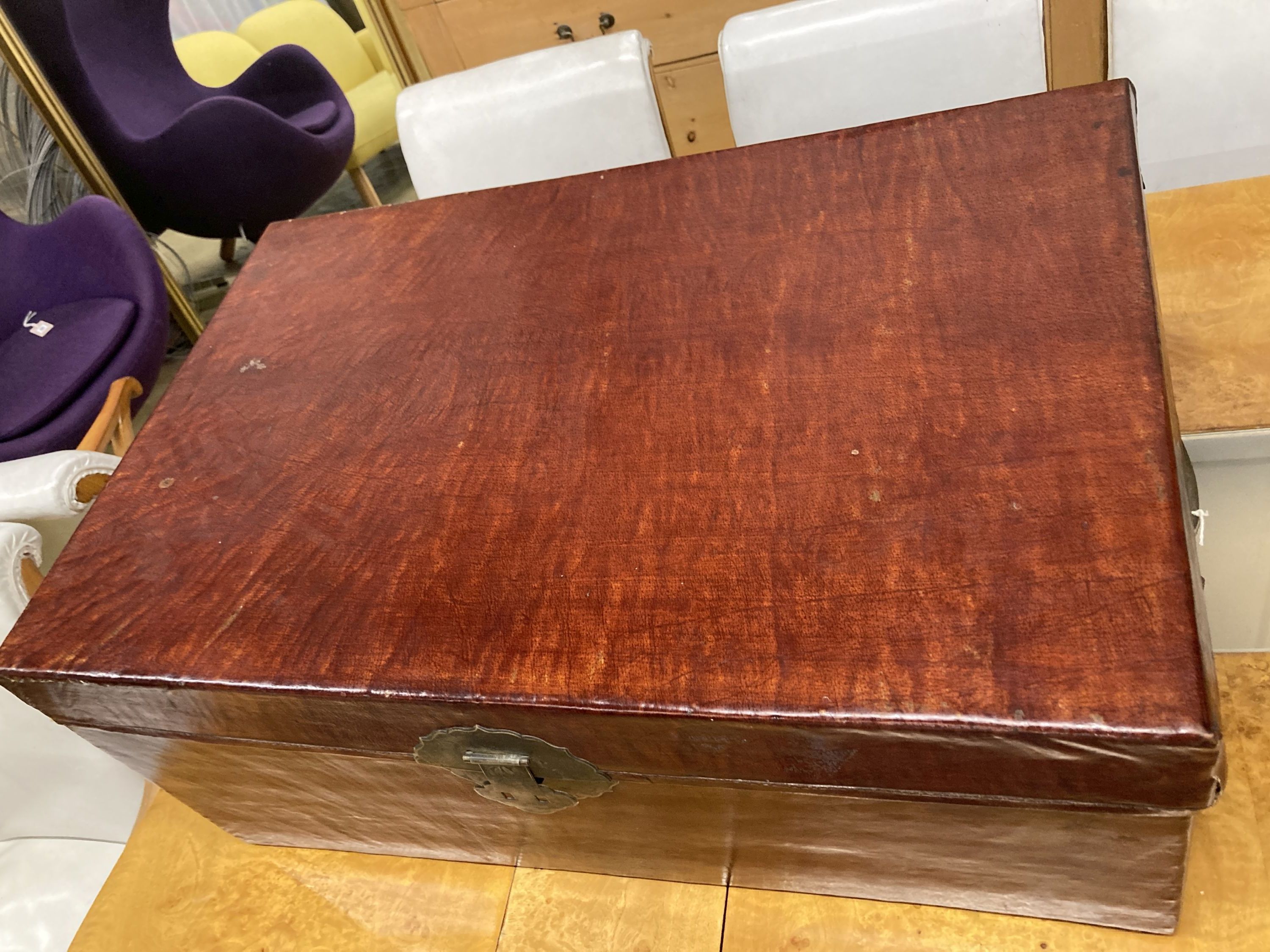 A Chinese leather bound trunk, width 80cm, depth 52cm, height 35cm